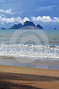 Poda island, Tup island and Chicken island seen from the shady beach of Ao Nang, Thailand