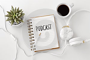 Podcast concept with headphones and notebook