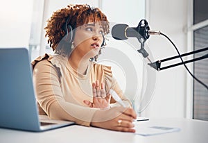 Podcast, microphone and black woman radio broadcast, content creation or recording virtual interview on laptop. Young
