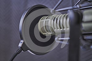 Podcast microphone closeup in a recording booth