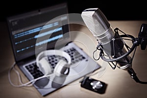 Podcast microphone and laptop computer in recording studio photo