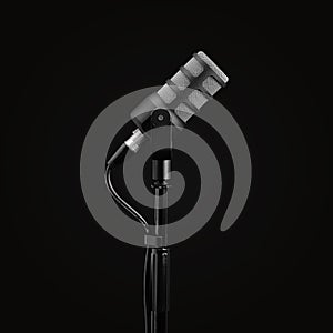 Podcast microphone on a tripod, a black metal dynamic microphone, isolated black background, recording podcast or radio program, s