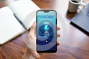 Podcast playing or recording application on mobile phone screen. Internet radio media concept.