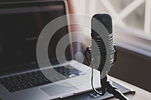 Podcast streaming, ON Air, Home studio podcast interior. Microphone, laptop and on air text
