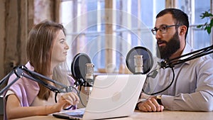Podcasting of topical programme man talks to woman in studio Spbas