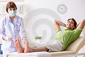 The podiatrist treating feet during procedure