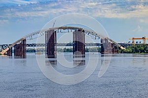Podilsko-Voskresenskyi Bridge or Podilskyi Metro Bridge is a combined road-rail bridge over the Dnieper River under construction