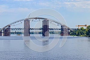 Podilsko-Voskresenskyi Bridge or Podilskyi Metro Bridge is a combined road-rail bridge over the Dnieper River under construction