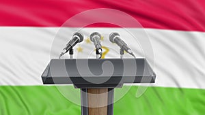 Podium lectern with microphones and Tajik Flag in background