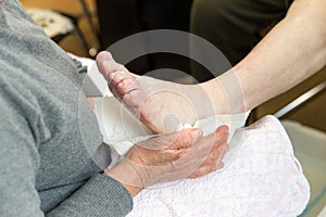 Podologist in preparation of a treatment of the feet