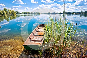 Podravina. Soderica lake wooden boat and water landscape view