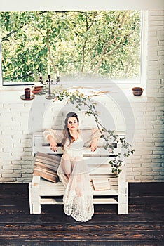 Poetry book at romantic writer. Beauty and fashion look in vintage style. Pretty girl in white wedding dress and retro