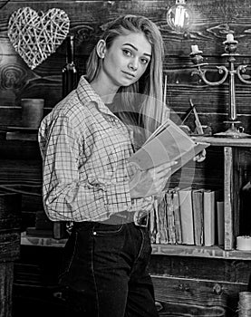 Poetry evening concept. Girl in casual outfit in wooden vintage interior enjoy poetry. Lady on dreamy face in plaid