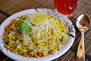Pohe is Flattened rice. Kande pohe is a popular breakfast of Maharashtra, India