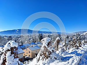 Pohorje mountain and city Maribor covered by white snow. Winter in Slovenia