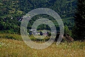 Poienile Izei- summer landscape with hills and haystacks