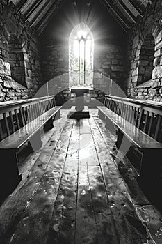 Poignant black and white photograph of quiet chapel on Good Friday. photo
