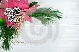 Poinsettia bouquet on whitewashed wood