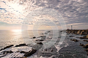 Point Arena Lighthouse with splashing surf at sunset