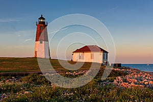 Point Judith Lighthouse on Atlantic Ocean at sunset