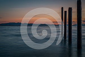 Point Roberts pilings and silky water at night time