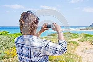 Point and shoot: girl using camera.
