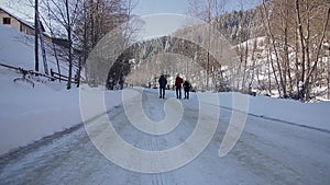 Point of view from drive`s side, vehicle driving on snowy mountain road.