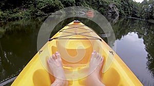 Point of view of feet in a kayak