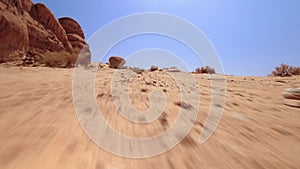 Point of view POV two hikers walk in Wadi Rum valleys in extreme heat together explore Jordan desert