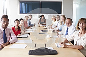 Point Of View Shot Of Businesspeople Around Boardroom Table