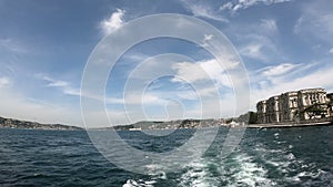 Point of View Shot from Ferry in Bosphorus Channel. White Foam Track Behind the SHip and Bosphorus Bridge in Frame.