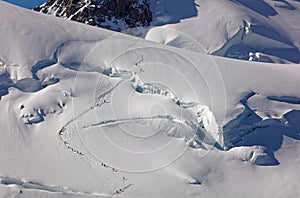 Pointe Lachenal, Chamonix, south-east France, Auvergne-RhÃƒÂ´ne-Alpes. Climbers heading for Mont Blanc - scaling Pointe Lachenal's