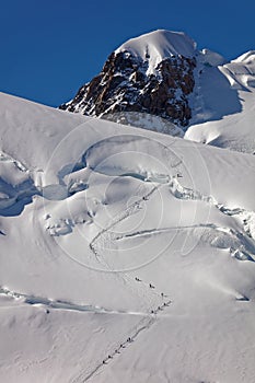 Pointe Lachenal, Chamonix, south-east France, Auvergne-RhÃƒÂ´ne-Alpes. Climbers heading for Mont Blanc - scaling Pointe Lachenal's