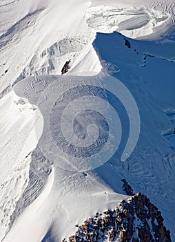 Pointe Lachenal, Chamonix, south-east France, Auvergne-RhÃ´ne-Alpes. Artistic snowdrifts created by power of wind at northern spur