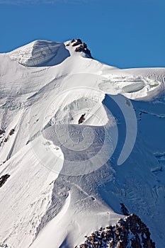 Pointe Lachenal, Chamonix, south-east France, Auvergne-RhÃ´ne-Alpes. Artistic snowdrifts created by power of wind at Pointe Lachen