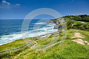 Pointe Saint Barbe of Saint jean de Luz, Basque Country. Atlantic Coast. Coastline, ocean waves, hill, green grass and pathway