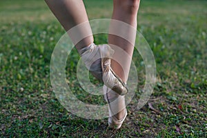 Pointe shoes on the feet of a ballerina