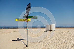 Pointers on the pillar and dressing cabin on the beach. photo