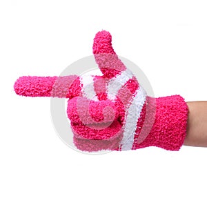 Pointing hand in knitted glove showing direction isolated