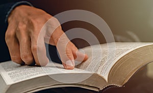 Pointing to a bible topic and read the Bible on Sundays to receive the blessings of God photo