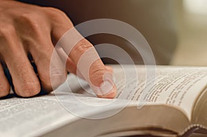 Pointing to a bible topic and read the Bible on Sundays to receive the blessings of God photo