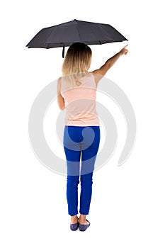 Pointing woman under an umbrella