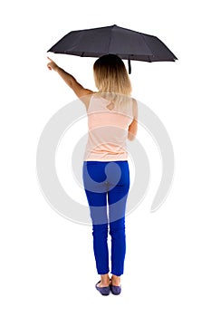 Pointing woman under an umbrella