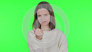 Pointing Young Woman Inviting on Green Background