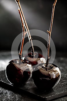 Poison toffee apples for Halloween on a black background