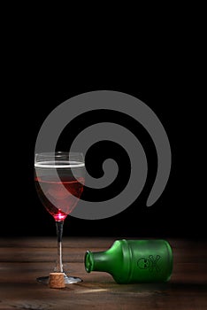 Poisoned glass of red wine photo