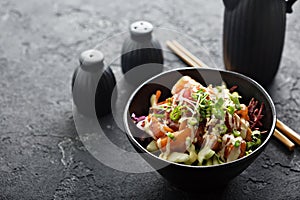 Poke bowl with salmon and vegetables photo