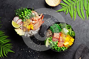 Poke bowls with shrimps, salmon, avocado and mango photo