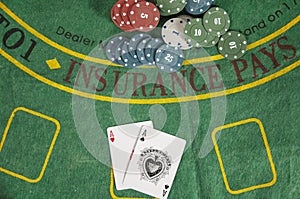 Poker aces with chips on green table