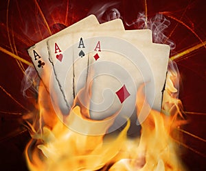 Poker cards burn in the fire